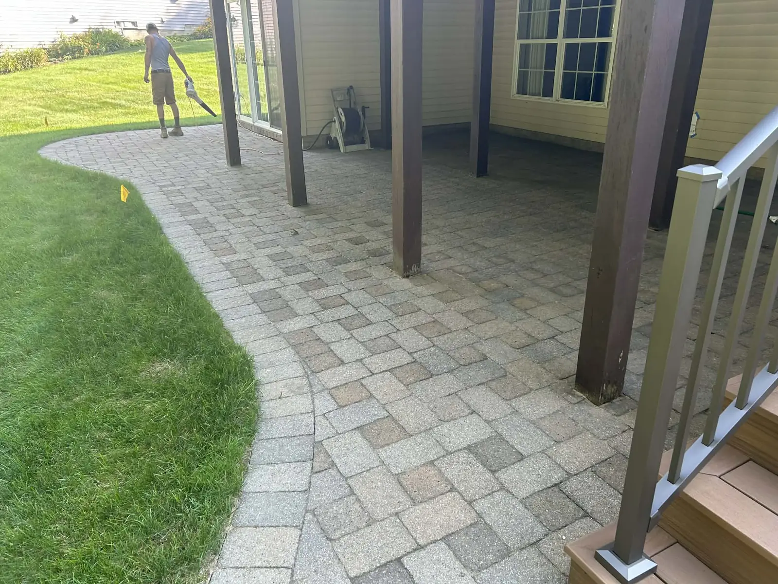 Finished paver patio beneath a residential deck